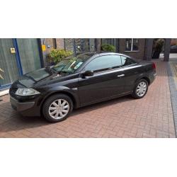 A stylish convertible Magane with red leather seats and full franchise service history