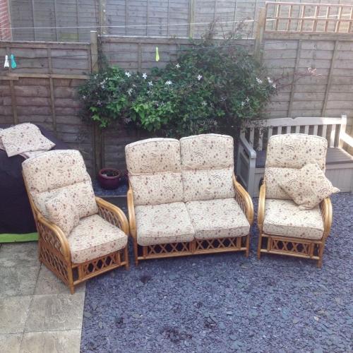 Cane conservatory suite with two small cushions and chairs not been in storage for last 3 years