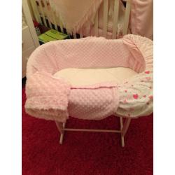 Pink Moses basket and rocking stand in white
