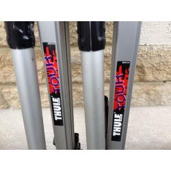 Two THULE TOUR roof rack bike carriers