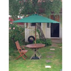 Large parasol and solid iron base.