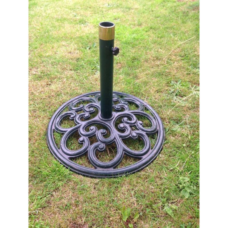Large parasol and solid iron base.
