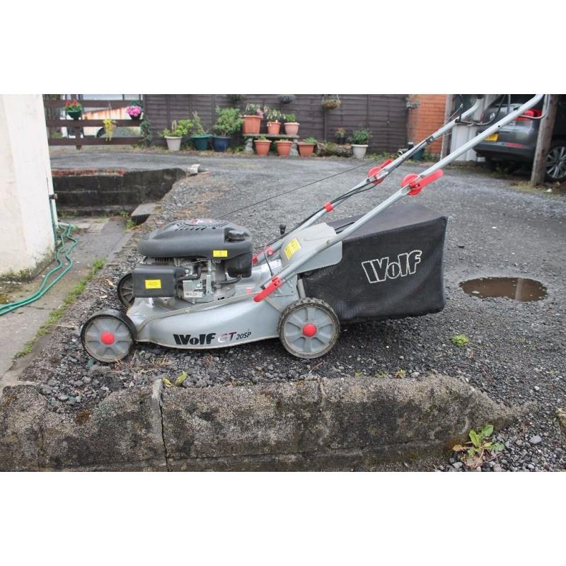Wolf four stroke 5hp self propelled lawn mower excellent suit large lawn