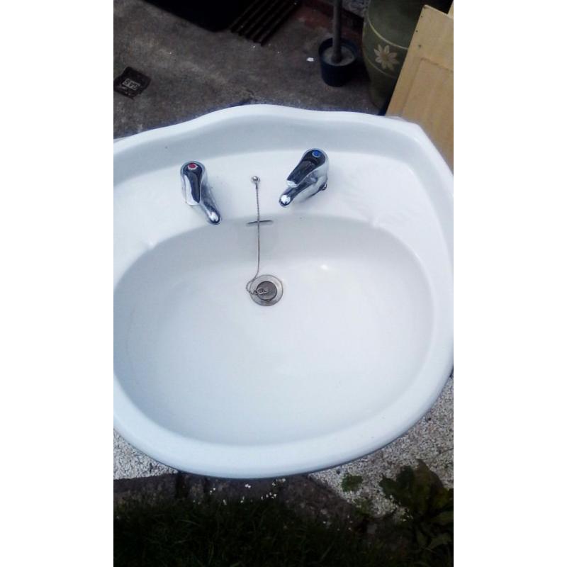Victoeian style sink and pillar candle stand