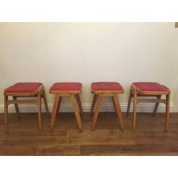 Vintage retro set of solid wood stacking stools.