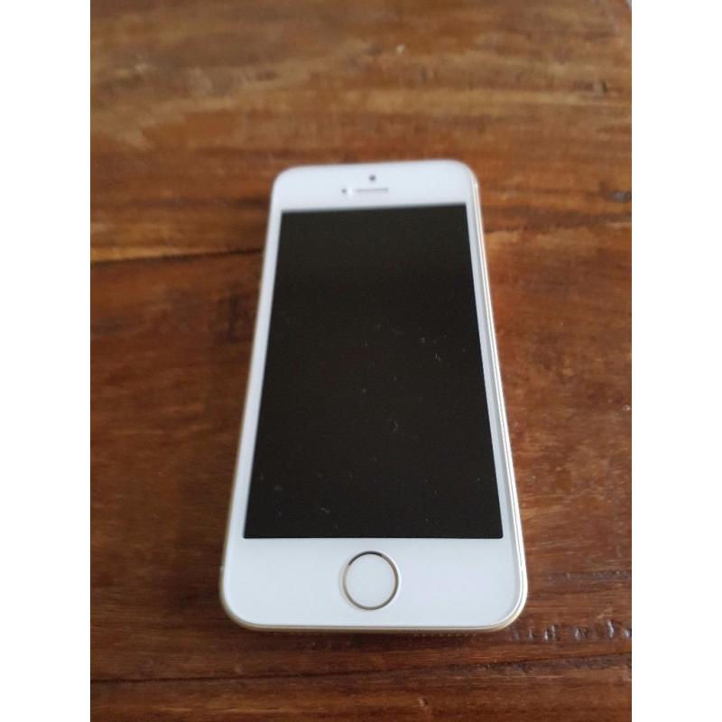 Iphone SE in gold on three. Mint condition.