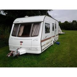 Coachman VIP 520/4 - 2002 parked at Wold Cottage Touring Park, Wold Newton Yorkshire