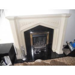 Stone effect fireplace with black marble insert