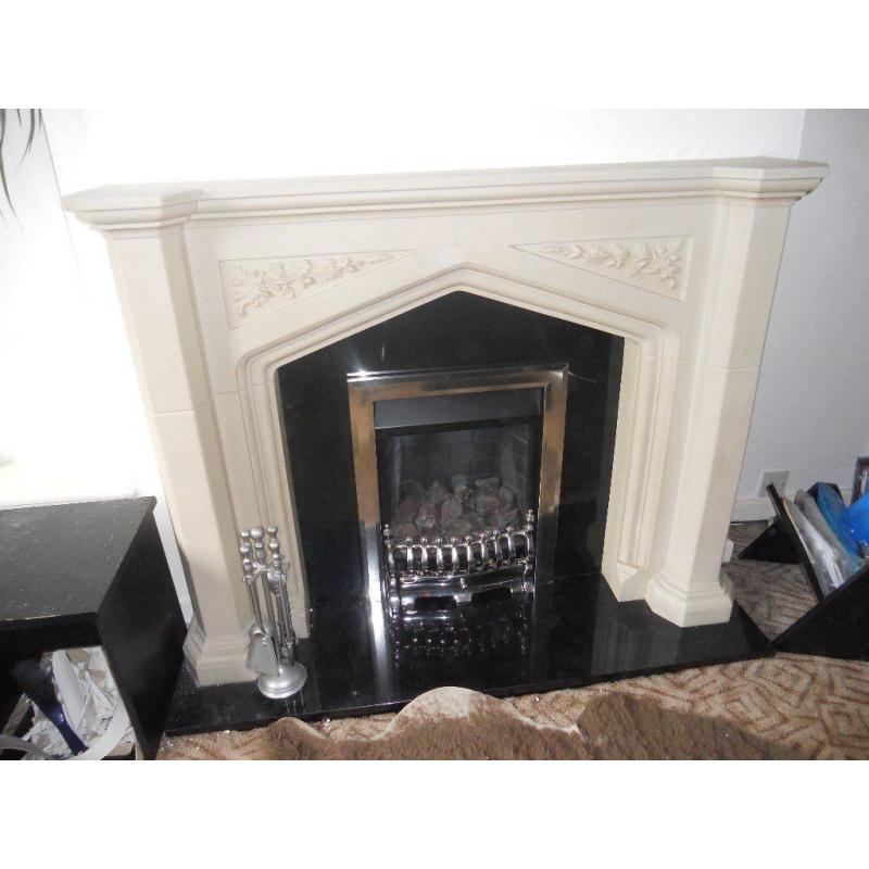 Stone effect fireplace with black marble insert