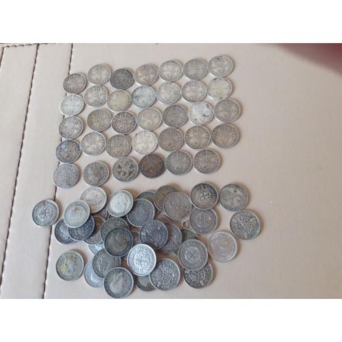 A COLLECTION OF 69 silver three pence coins
