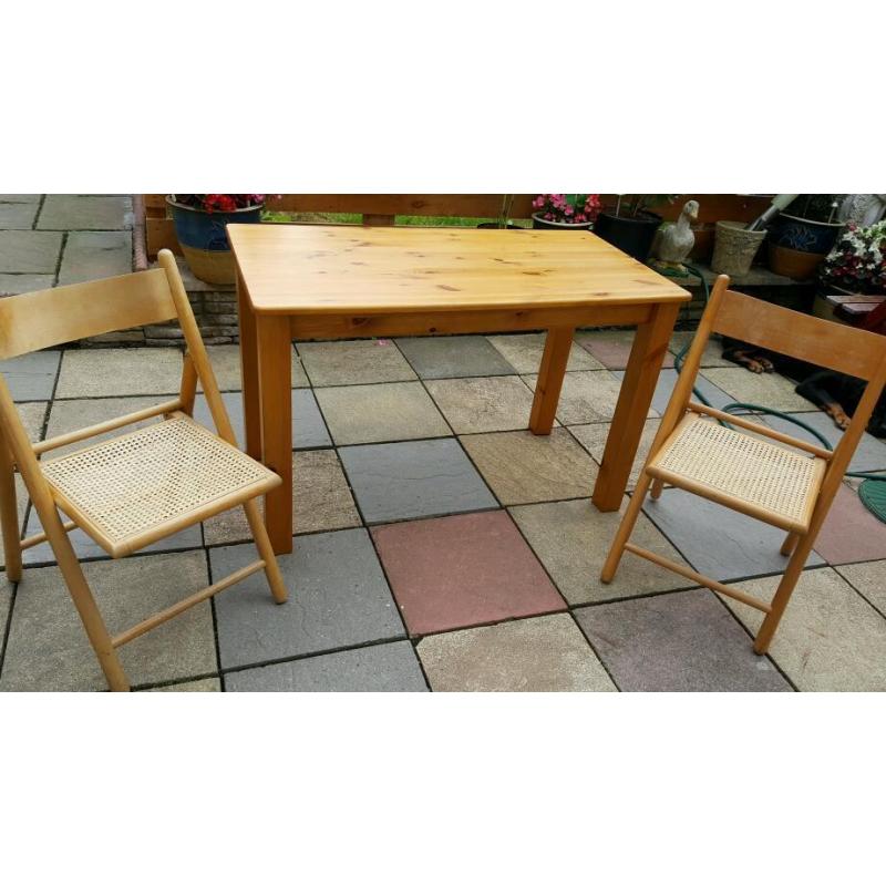 table and two folding chairs