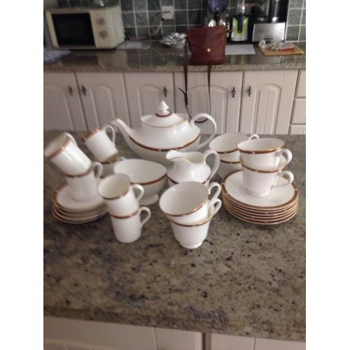 Tea set with teapot, milk jug, sugar bowl and coffee cups