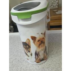 hard dog bed in black and food container