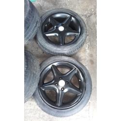 Vauxhall 4 stud black alloys 4x100 fitment. recently repainted tyres are bad one or two might do