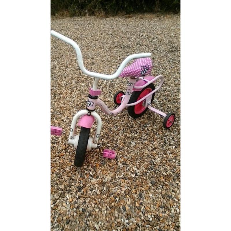 Girls pink bike Hello Kitty With 9" wheels and has stabilisers