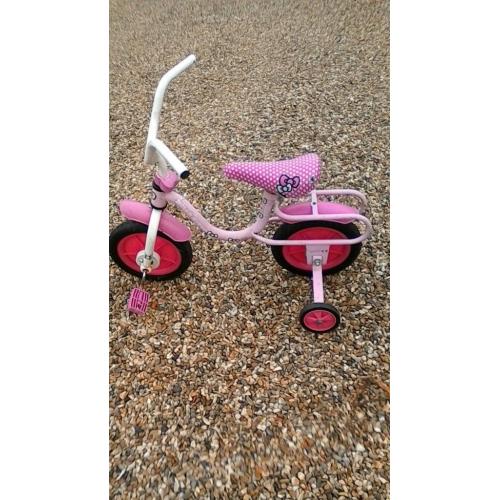 Girls pink bike Hello Kitty With 9" wheels and has stabilisers