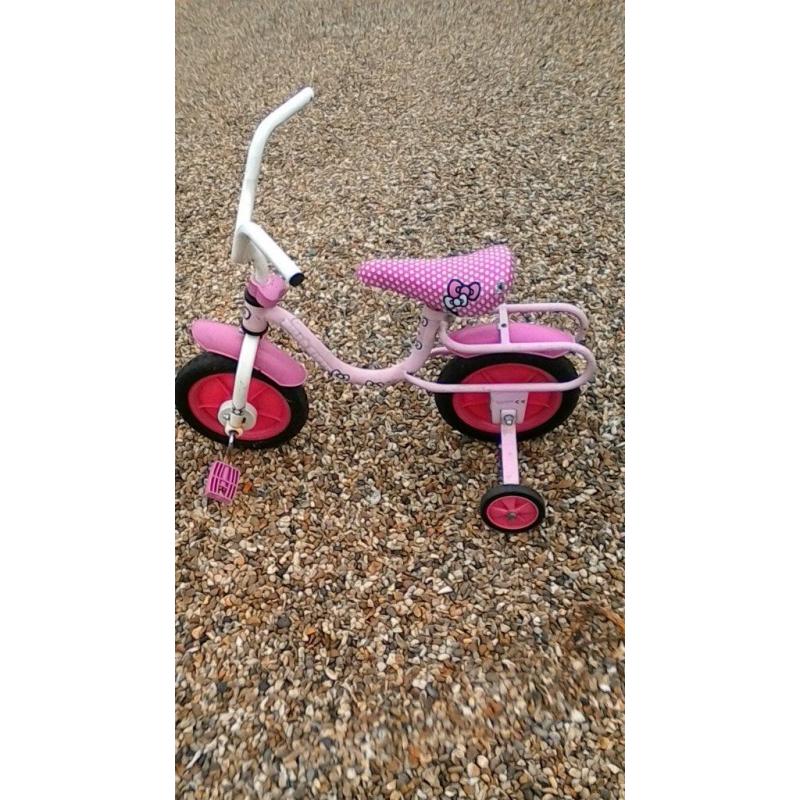 Girls pink bike Hello Kitty With 9" wheels and has stabilisers