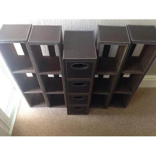 Faux leather DVD storage and drawers.