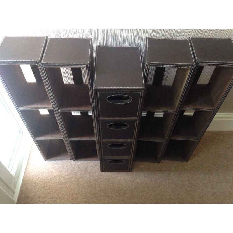 Faux leather DVD storage and drawers.