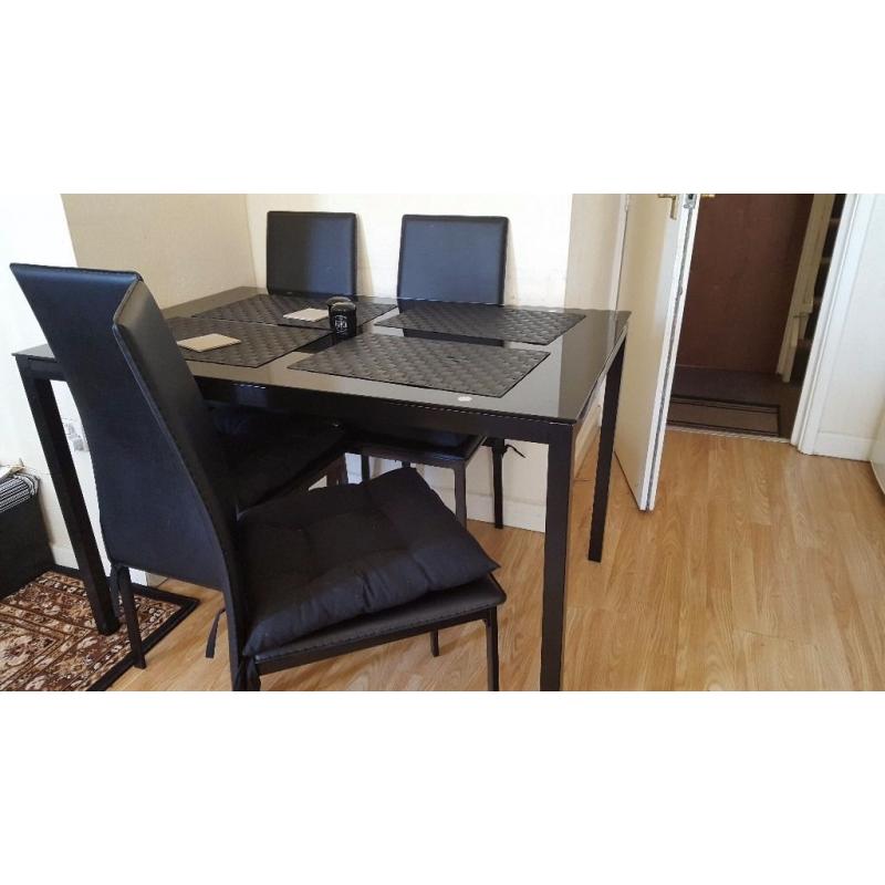 Dining table and 4 high backed chairs