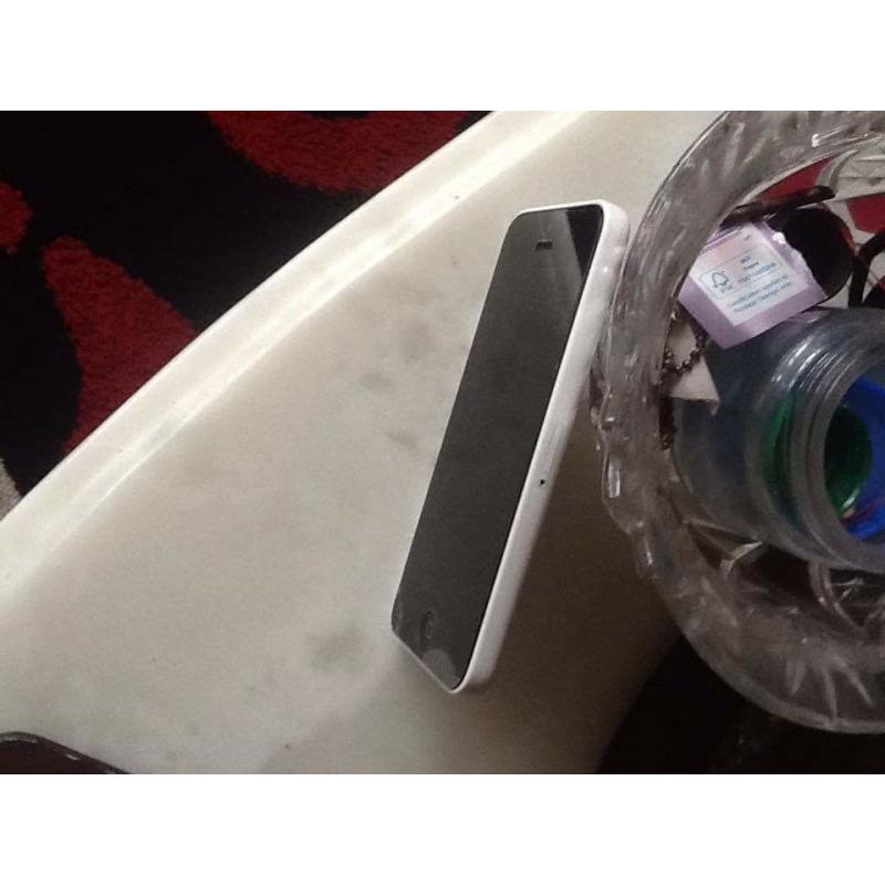 White iPhone 5c with little airline crack but hardly noticable in corner plus.....