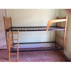 Bunk beds or two singles, wooden frame, metal sprung. Free
