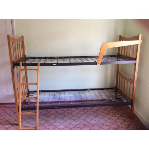 Bunk beds or two singles, wooden frame, metal sprung. Free