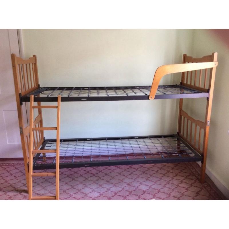 Bunk beds or two singles, wooden frame, metal sprung. Free