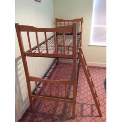 Bunk beds or two singles, wooden frame, metal sprung. Free