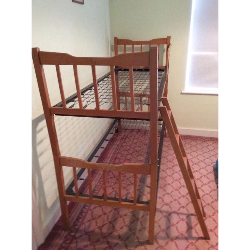 Bunk beds or two singles, wooden frame, metal sprung. Free