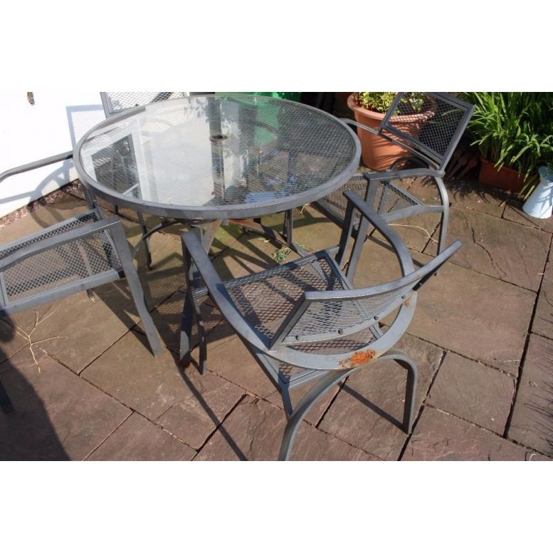 Sturdy set of 4 patio chairs and table.