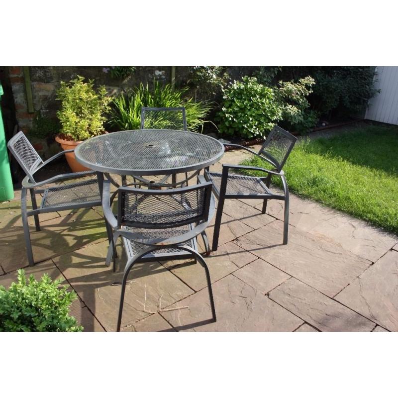 Sturdy set of 4 patio chairs and table.