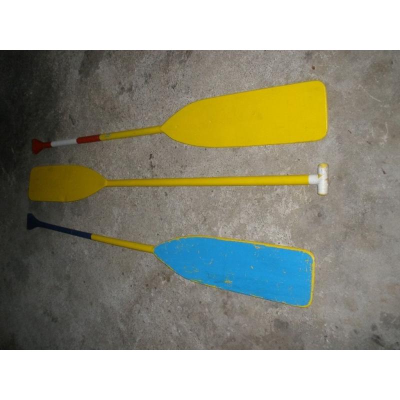 3 wooden paddles