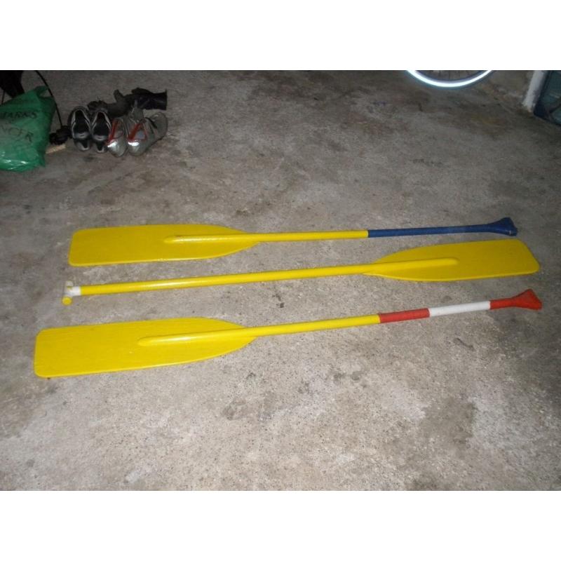 3 wooden paddles