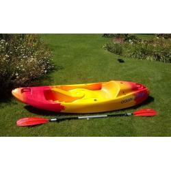 Single person sit on top ocean kayak with free paddle