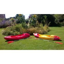 Single person sit on top ocean kayak with free paddle