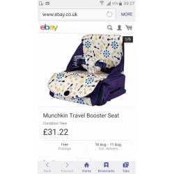 New unused munchkin travel booster seat