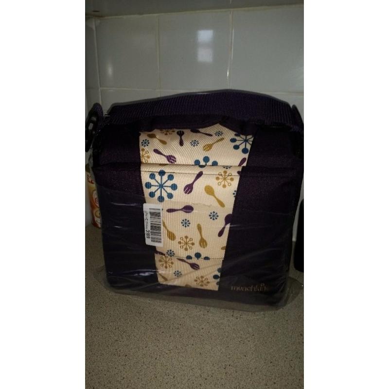 New unused munchkin travel booster seat