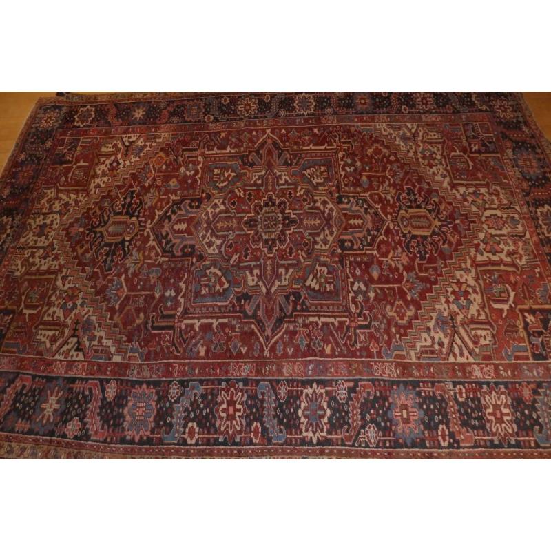 70 year old large Heriz rug