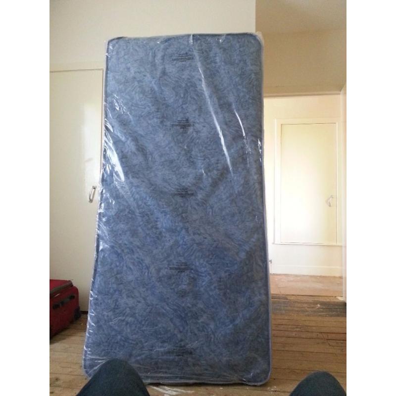 Brand new single bed still in plastic covers. Blue. See photos.
