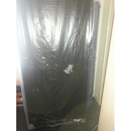 Brand new single bed still in plastic covers. Blue. See photos.
