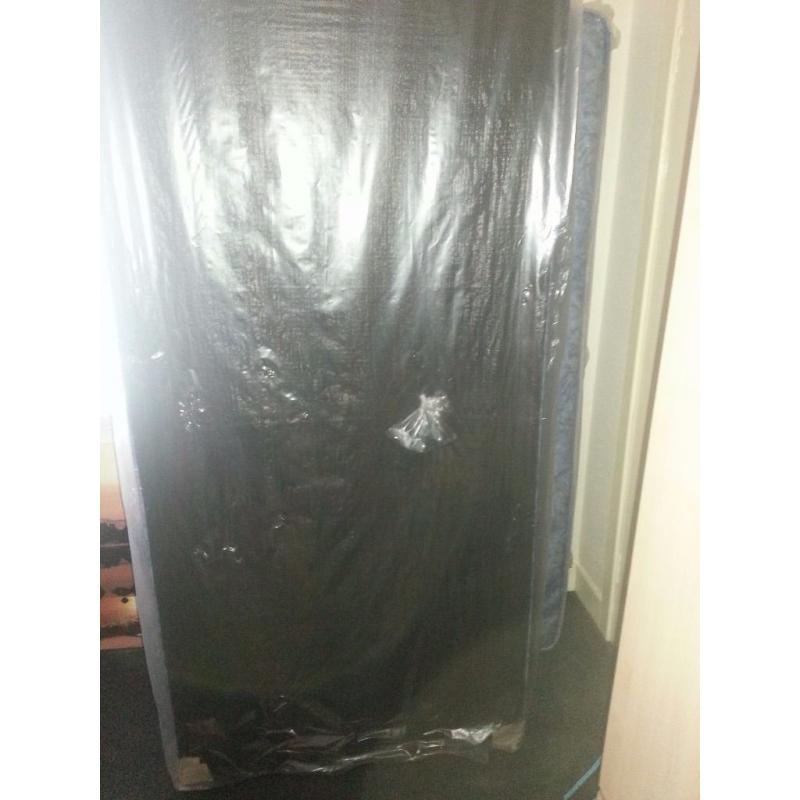 Brand new single bed still in plastic covers. Blue. See photos.