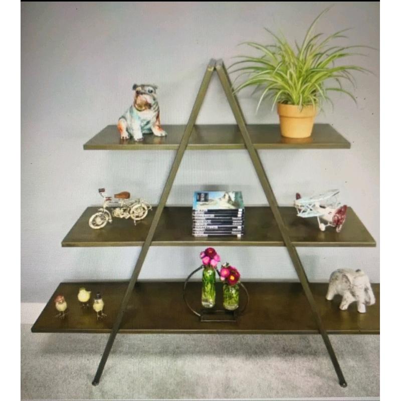 Large gold coloured industrial shelving unit