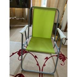 A pair of plastic folding chairs for picnic - pistachio green