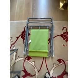 A pair of plastic folding chairs for picnic - pistachio green